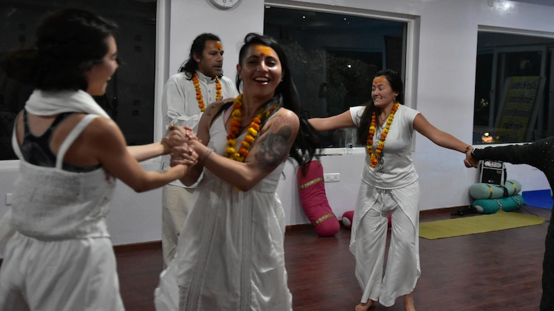 A group practicing Kundalini Yoga Teacher Training in Rishikesh