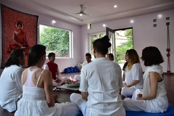 Students practicing meditation teacher training in Rishikesh